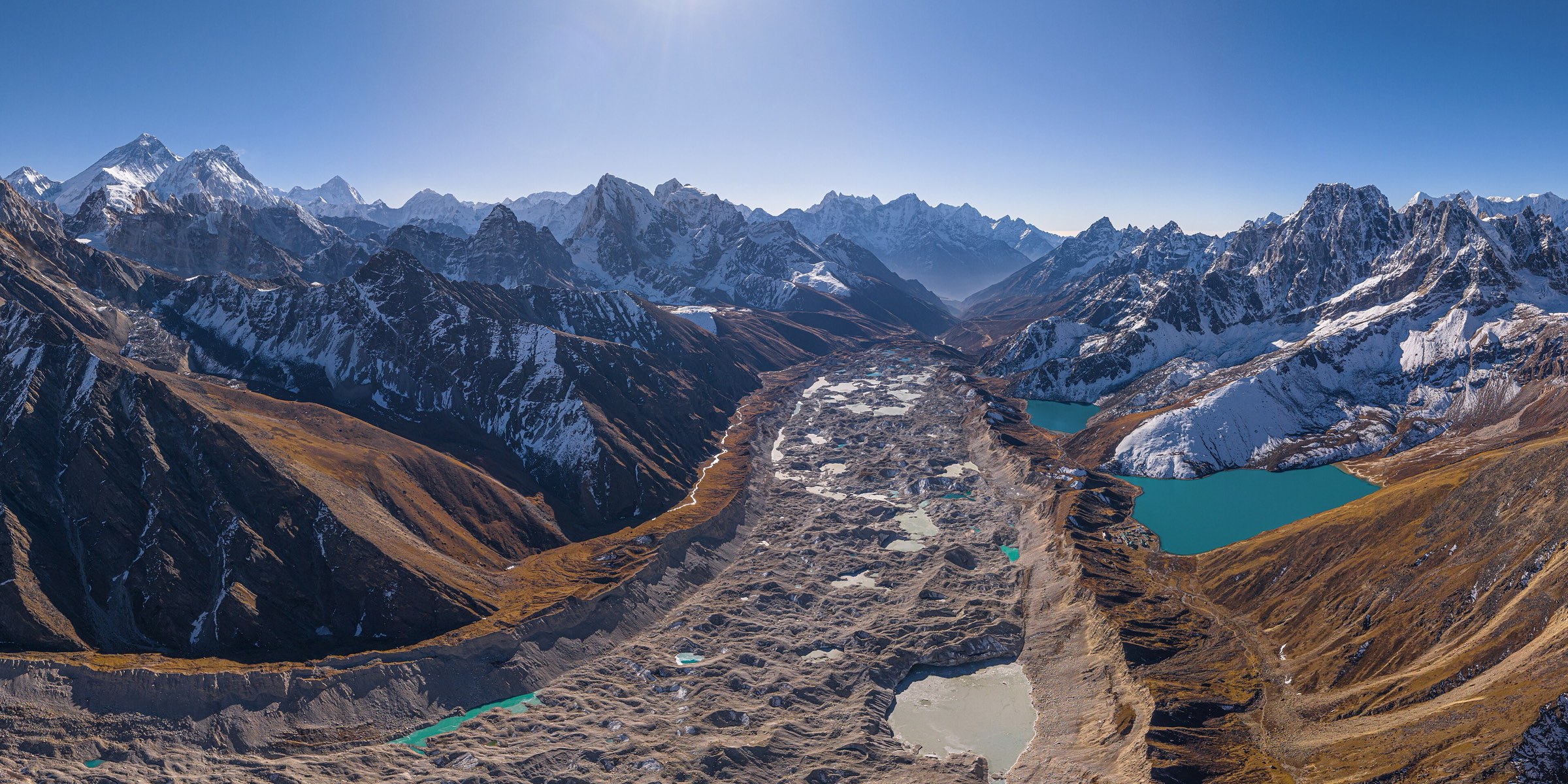 The Ngozumpa glacier and the Gokyo lakes from a ridge, under the peaks of Khumbu